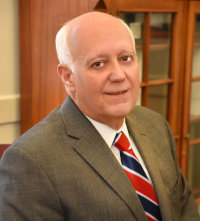 John D. Uelmen, General Counsel