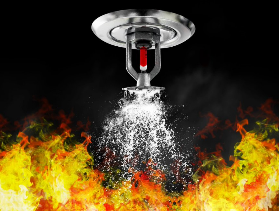 fire sprinkler battling a blaze