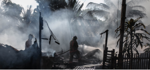 Image of firefighters in a smoky disaster zone